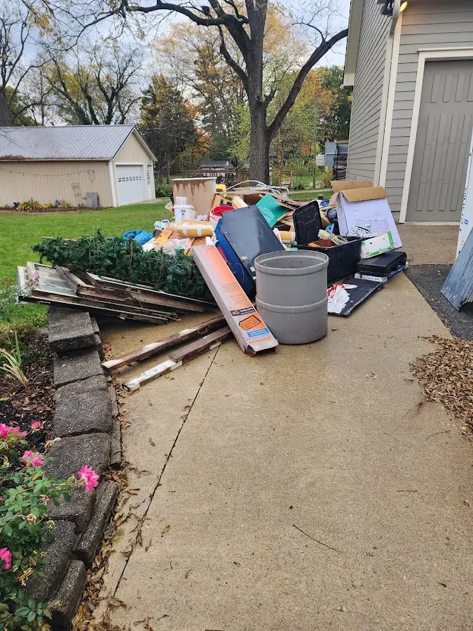 Dumpster being loaded with debris for 12 Yard Dumpster Rental in Amberley